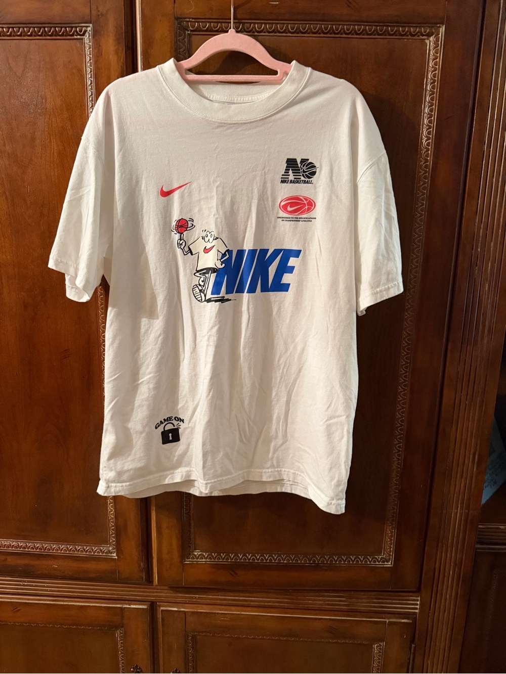 Nike White Short-Sleeve Graphic Basketball Tee with Blue Logo